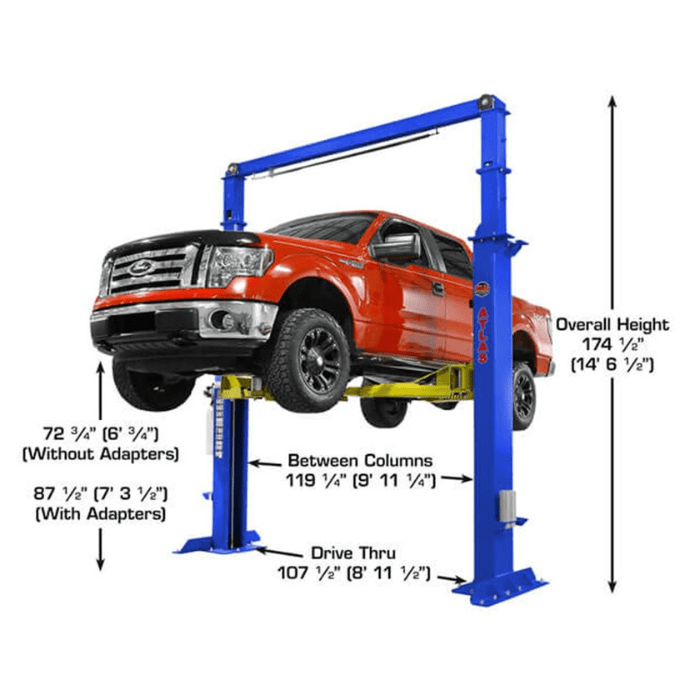 Angled front view of the Atlas PVL15 lifting a full-size pickup truck, demonstrating its extra-tall column height, broad drive-thru clearance, and heavy-duty commercial capabilities.
