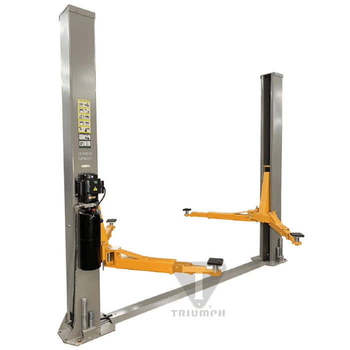 Angled side view of the Triumph NT-11 Vehicle Lift showcasing heavy-duty orange lift arms, dual-post steel columns, and the mounted hydraulic power unit for optimal garage performance.