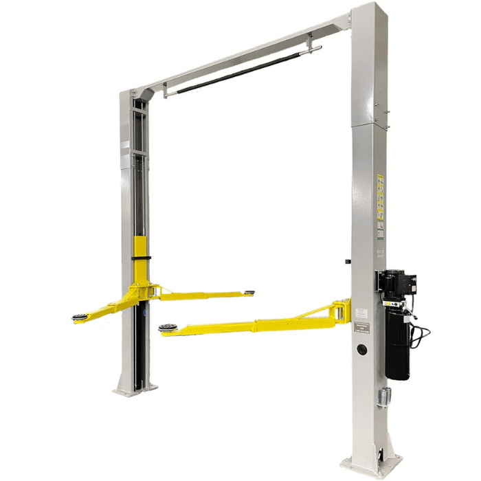 Angled side view of the Triumph NTO-9AE 9,000 lb Two-Post Car Lift showing asymmetric yellow arms and overhead bar for maximum lifting clearance.