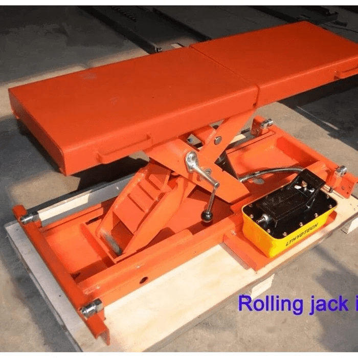Angled view of the Katool KT-RJ50 5,000 lb Rolling Bridge Jack, showing its orange scissor-lift mechanism and hydraulic pump for auxiliary lifting on four-post lifts.