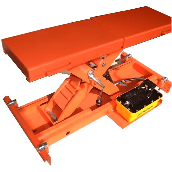 Angled view of the Katool KT-RJ50 Bridge Jack with an orange scissor-lift design and a compact hydraulic pump for auxiliary vehicle lifting on four-post lifts.