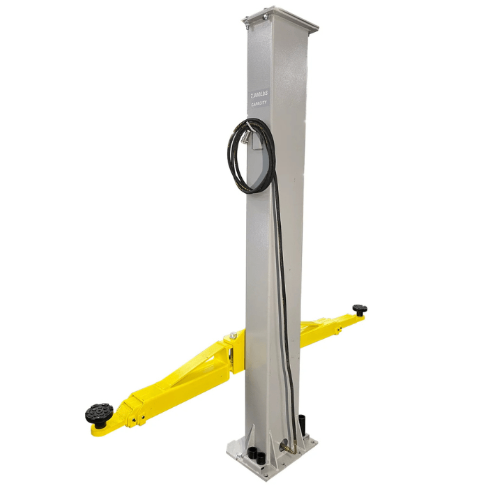 Angled view of the Triumph C7000 Portable Two Post Lift column with hydraulic hoses wrapped neatly and symmetric yellow lift arms extended for operation.
