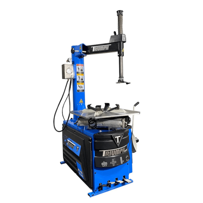 Angled view of the Triumph NTC-950 Tire Changer Machine featuring a blue cabinet, swing-arm design, and pneumatic assist tower.