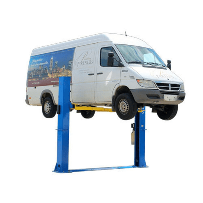 Atlas BP10000X two-post car lift pictured from a front-right angle, shown elevating a commercial van with baseplate design visible.