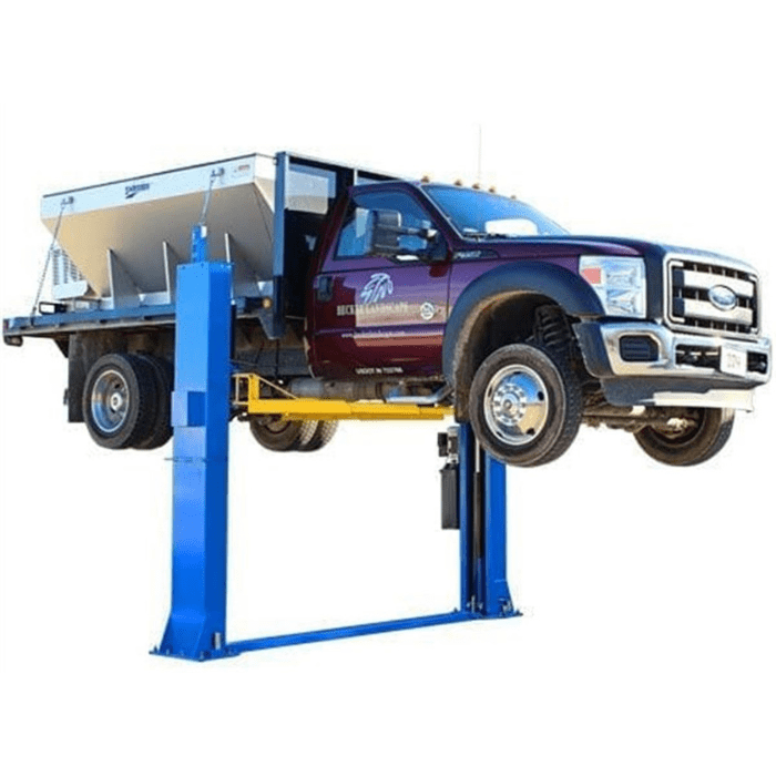 Atlas BP12000X baseplate two-post lift shown raising a heavy-duty commercial truck, designed for high-capacity lifting with a stable floorplate structure.