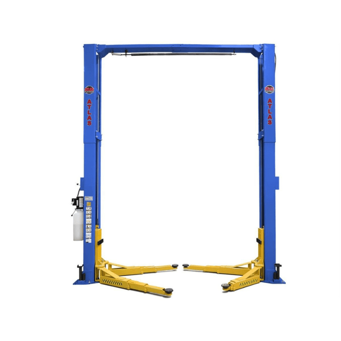 Atlas PVL12 overhead two-post lift displayed with arms fully lowered, engineered for professional use with an ALI-certified frame and high-clearance design.