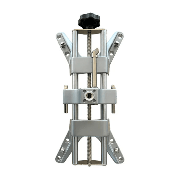 Close-up of the Katool KT-AV533 alignment clamp assembly with adjustable jaws and a top knob for secure wheel rim attachment.