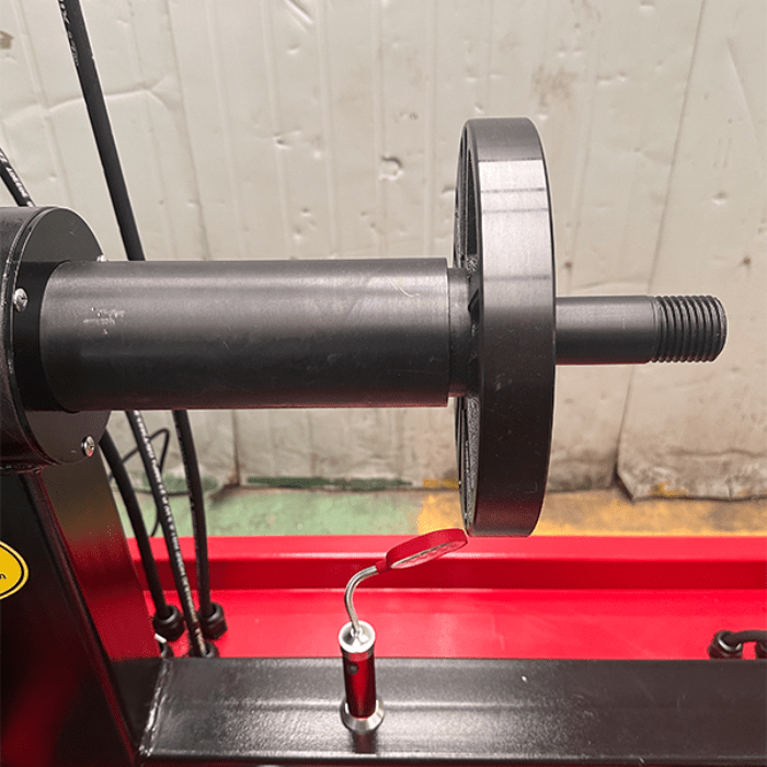 Close-up of the Katool KT-WL70 machine’s spindle and hand wheel, used for secure wheel mounting and precise alignment during rim repair.