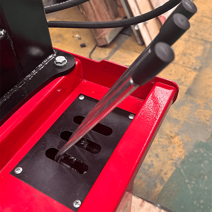 Close-up of the Katool WL70 Rim Straightener’s red housing with manual control levers for precise wheel adjustment.