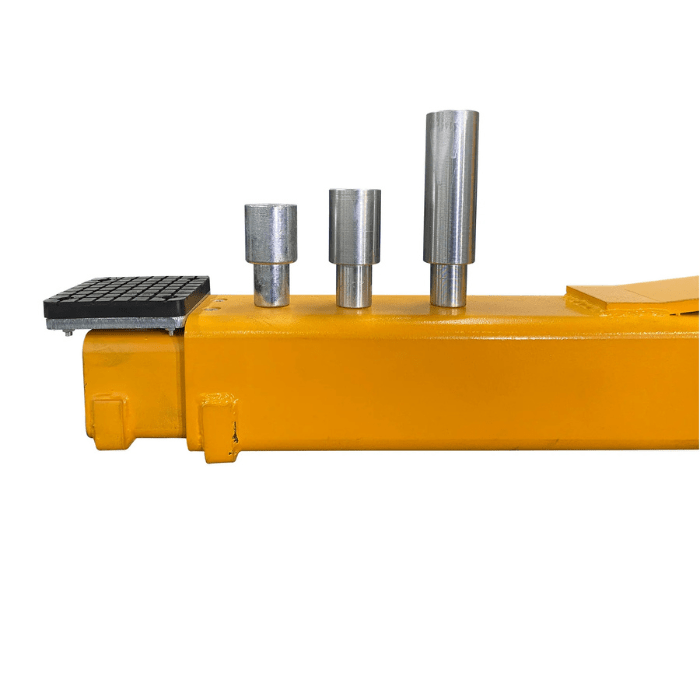 Close-up of the Triumph 15,000 lb Two Post Vehicle Auto Lift (NT-15) arm, showing stackable metal height adapters and a rubber lift pad for secure vehicle contact.