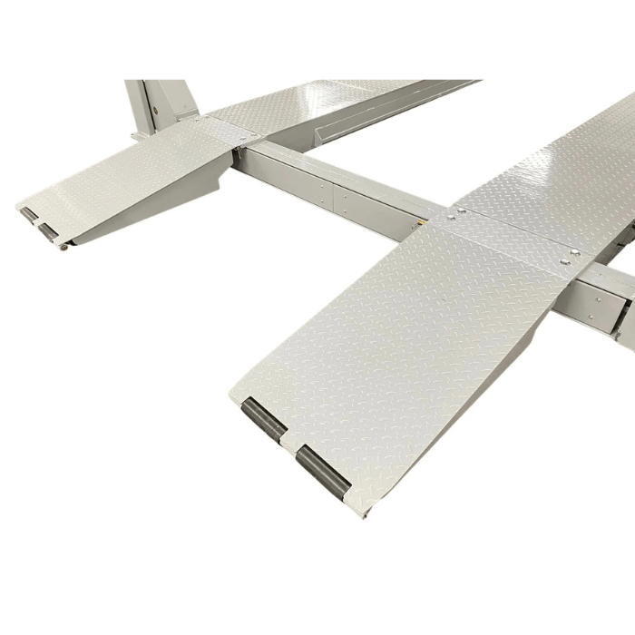 Close-up of the Triumph NTR-32 32,000 lb Heavy-Duty Four-Post Lift’s diamond-plate ramps for easier vehicle loading.