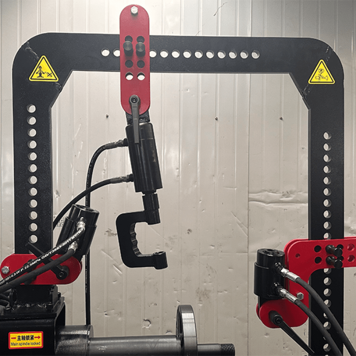 Close-up of the adjustable overhead bracket and hydraulic cylinder on the Katool WL70 Rim Straightening Machine for precise wheel alignment.
