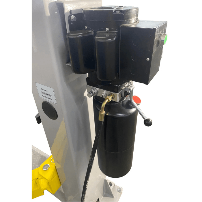 Close-up of the hydraulic power unit on the Triumph NTO-9AE Vehicle Lift, highlighting the control lever and fluid reservoir.