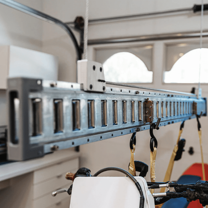 Closeup of a hook on the Auxx-One holding up a dirt bike