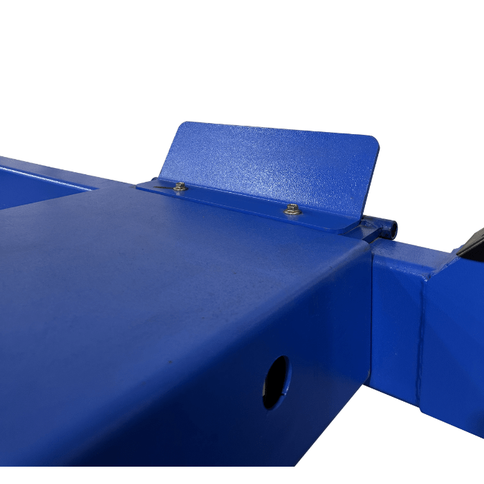 Detail of a runway stop plate bolted to the end of the lift’s steel platform.