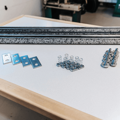 Everything included with the Additional Hardware Kit on a table