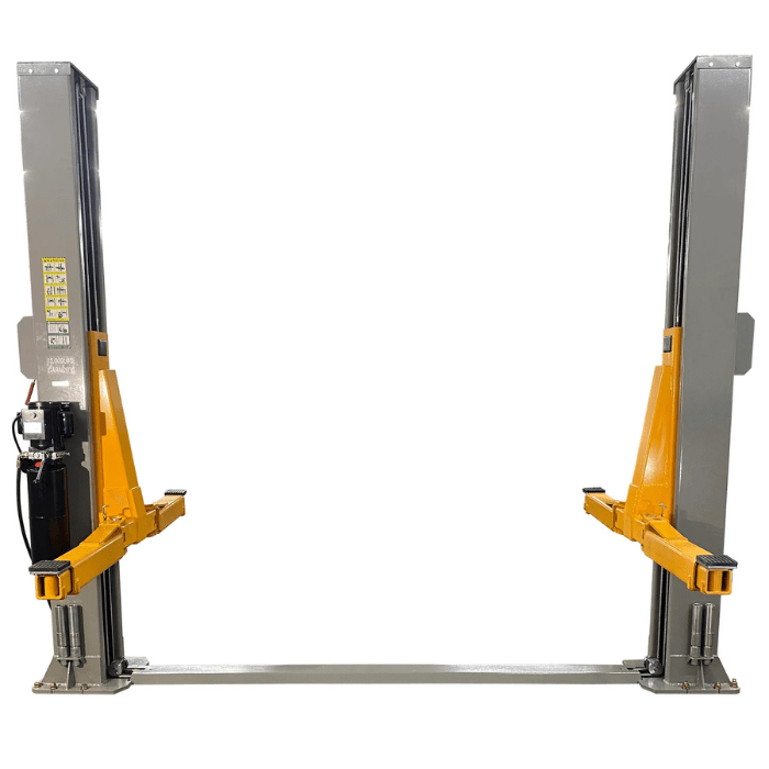 Front-facing view of the Triumph NT-15 15,000 lb Two-Post Car Lift, featuring reinforced grey columns, adjustable orange arms, and a stable floor-anchored design for heavy-duty vehicle lifting.