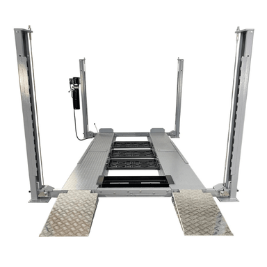 Front approach of the Triumph NSS8X-1 Vehicle Lift with diamond-plate runways and four steel columns.
