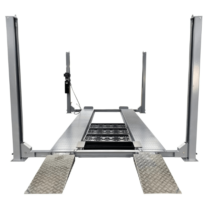 Front approach view of the Triumph NSS-11 Vehicle Lift, showcasing diamond-plate ramps, sturdy steel posts, and a central platform for 11,000 lb capacity vehicle support.