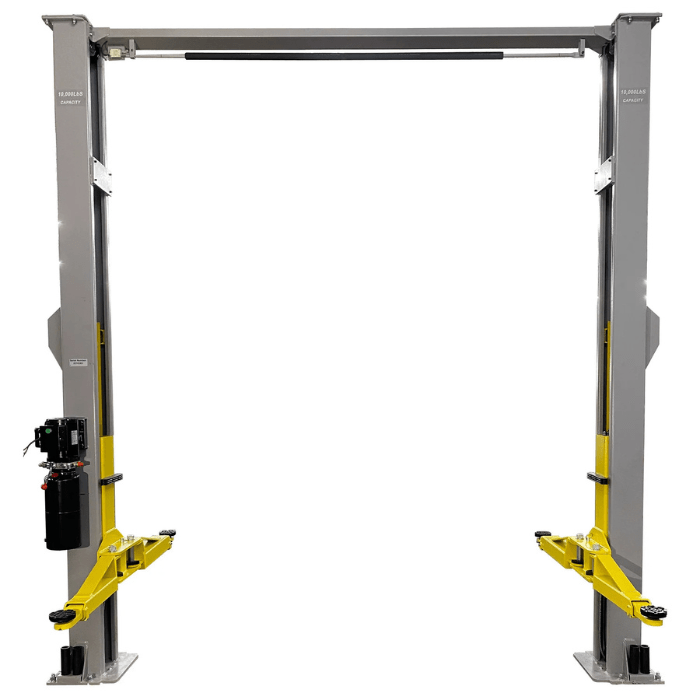Front view of the Triumph NTO-10A Lift featuring dual post design, overhead cable assembly, and heavy-duty yellow arms built for 10,000 lb vehicle lifting capacity.
