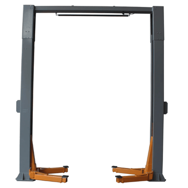 Front view of the Triumph NTO-20S Two-Post Heavy-Duty Lift with compact orange lift arms in a lowered position and reinforced steel columns designed for large vehicle service bays.