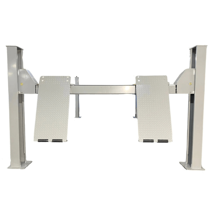 Front view of the Triumph NTR-24 Vehicle Lift with raised diamond-plate approach ramps and tall steel columns.