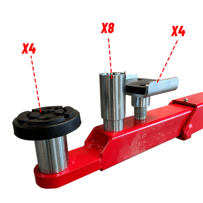 Height adapters and rubber pads arranged on a swing arm of the Katool KT-M150D 15,000 lb two post car lift (4 short, 8 medium, 4 tall pieces shown).