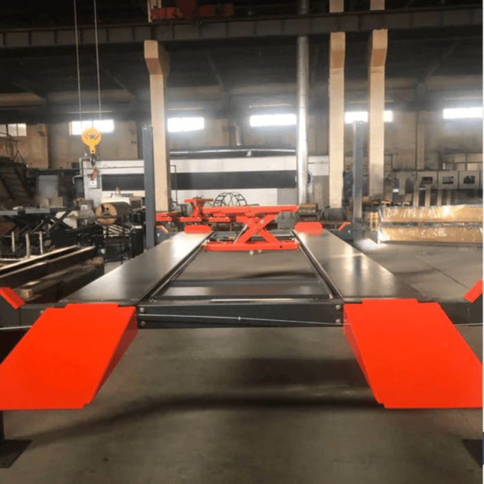 Katool 4H110 4-post car lift with rolling bridge jack inside industrial garage