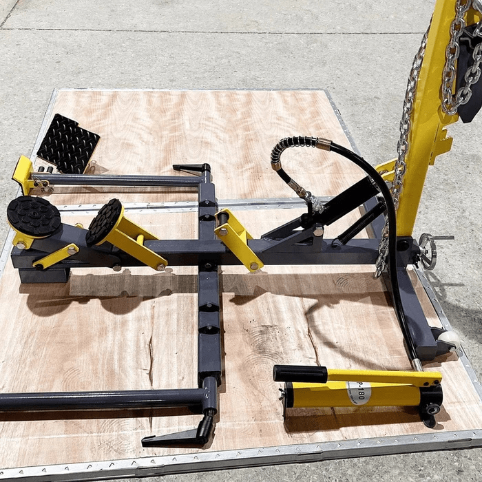Katool KT-222 Auto Body Frame Straightener & Pulling System with hydraulic ram, adjustable clamps, and support arms set on wooden platform
