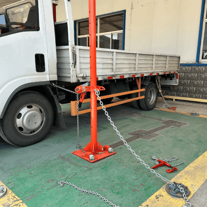 Katool KT-SB288 Frame Straightener & Pulling System in use on a commercial truck with chained anchoring for heavy-duty frame repair.