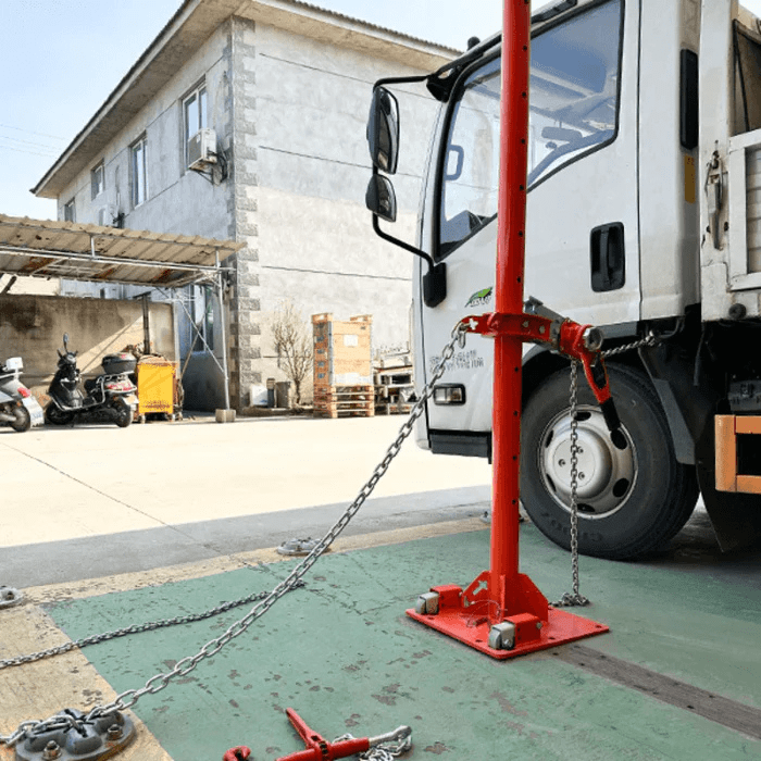 Katool KT-SB288 Truck Frame Straightener anchored to ground and pulling damaged truck frame with heavy-duty chain system.