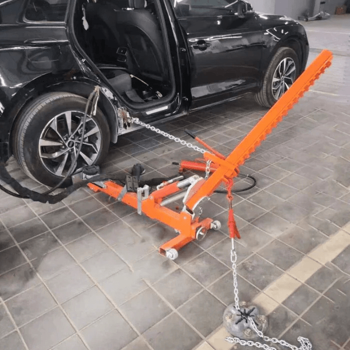 Katool KT-YA260 Auto Body Frame Straightener – live demo setup pulling rear quarter panel on black vehicle with hydraulic and chain anchoring system.