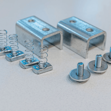 Show all the screws and bolts that come with the Auxx Additional Hardware Kit