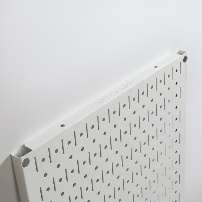 Showing the side of the Signature Series Textured Matte Metal Pegboard Panel with the words wall control on the side