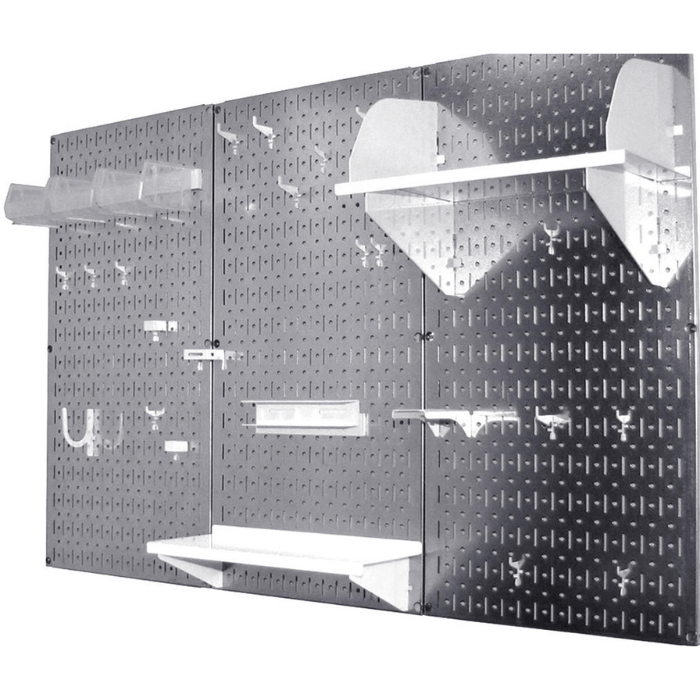 Showing the white accessories from the Wall Control Perfect Starter Accessory Pack on a pegboard