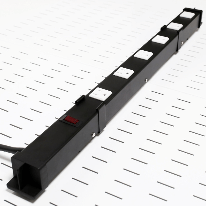 Side view of the Pegboard-Mounted Power Strip & Charging Station mounted to a pegboard