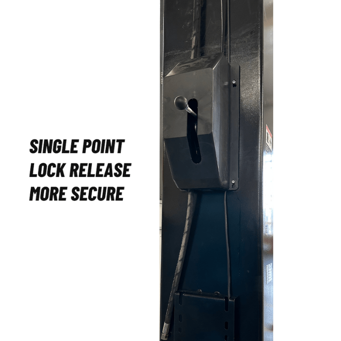 Single-point mechanical lock-release lever mounted on the column of a Katool 15,000 lb two post lift for secure lowering.
