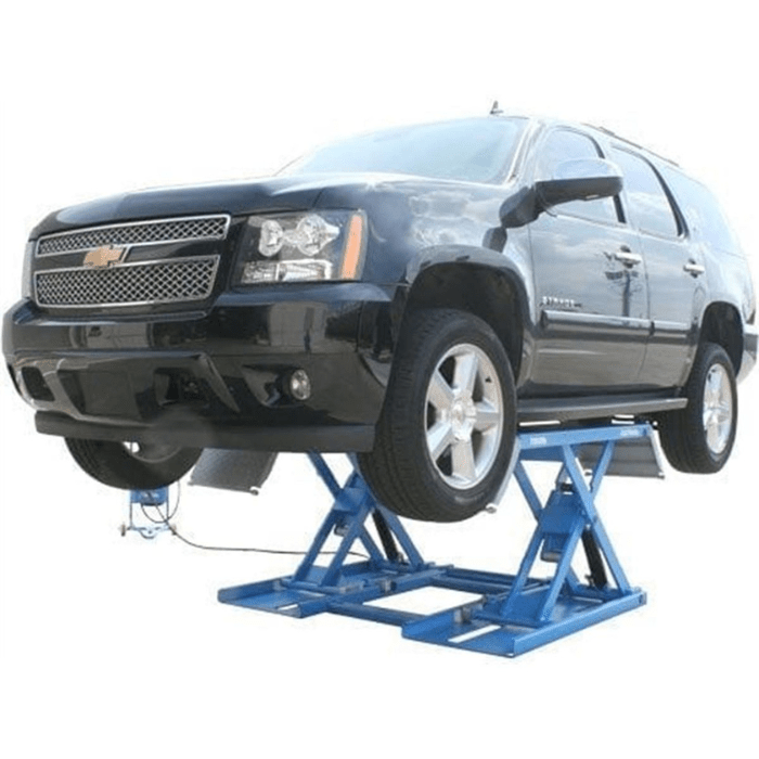 The Atlas 7K-Kwik-Bay mid-rise lift is seen raising a full-size SUV, delivering up to 7,000 lbs. of support—ideal for shops needing portable power and fast setup.
