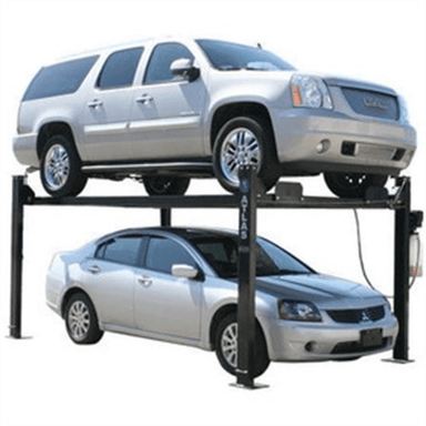 The Atlas PRO8000 four-post lift in action—stacking a full-size SUV above a sedan to highlight its space-saving storage design and dependable lifting capacity for residential or light-duty commercial use.