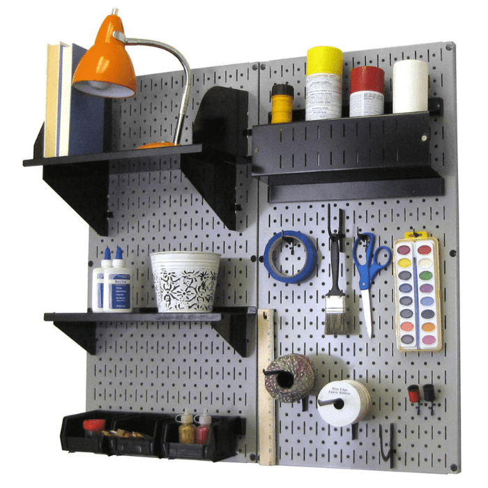 The Craft Hobby Pegboard Kit with gray pegboard and black accessories with materials