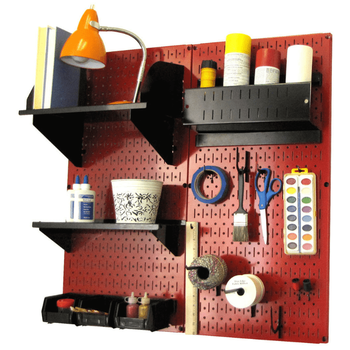 The Craft Hobby Pegboard Organizer Kit with red pegboard and black accessories with materials