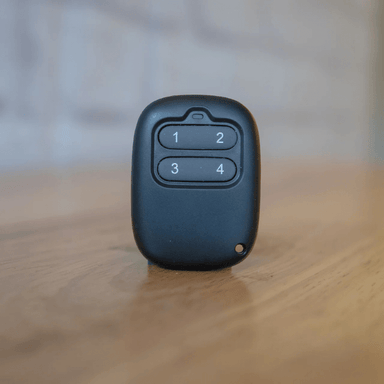 The Extra Wireless Remote by Auxx-Lift on a table