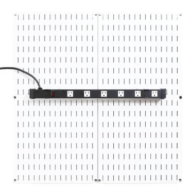 The Pegboard-Mounted Power Strip & Charging Station mounted to a white pegboard