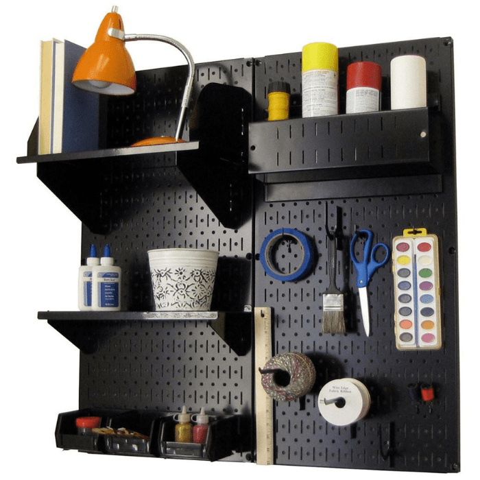 The Pegboard Organizer Kit by Wall Control with black pegboard and black accessories with materials