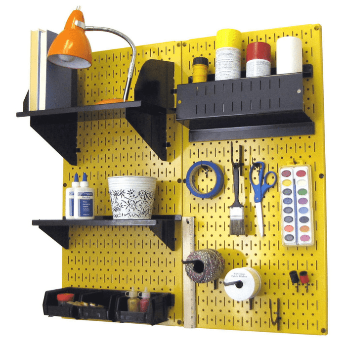The Pegboard Organizer Kit by Wall Control with yellow pegboard and black accessories with materials