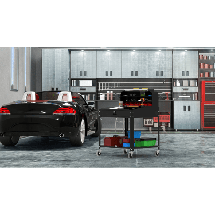 The Shop Desk with Pigeonhole Bin Unit by Luxor inside of a garage