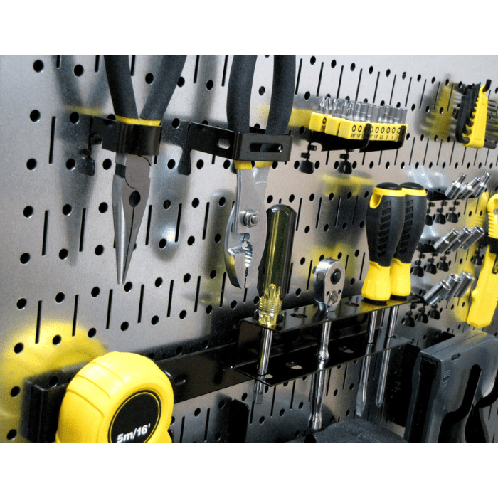Tools on black accessories mounted to the 16in x 32in Horizontal Metal Pegboard Panel