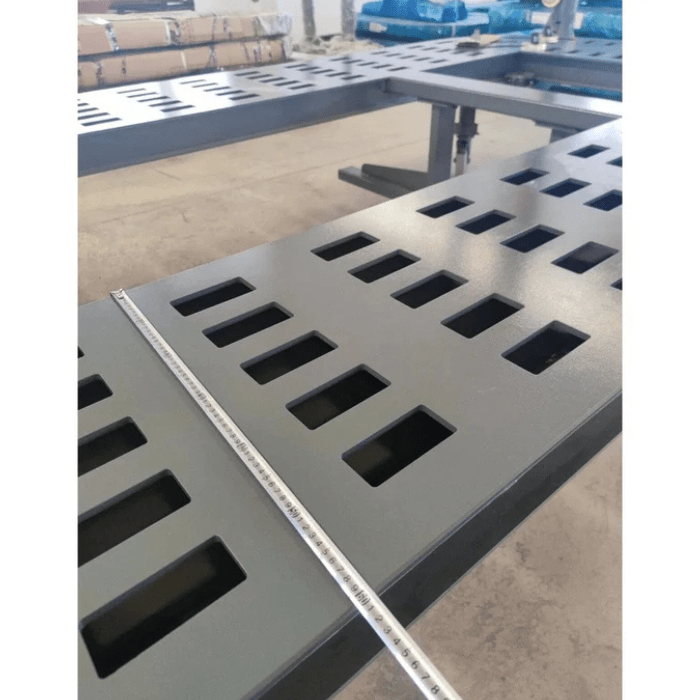 Top view of Katool KT-299U Frame Machine platform with width measurement tape across heavy-duty slotted steel deck