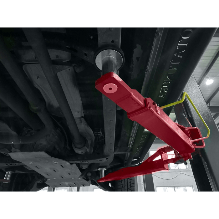 Under side view of the  Katool KT-H120D 12,000lbs Two Post Car Lift holding a car