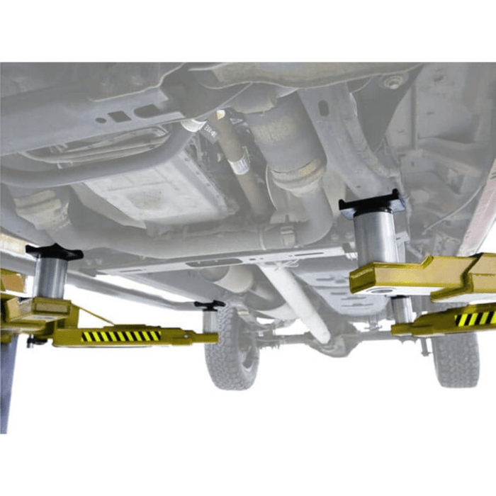 Underside view of a vehicle supported by the Atlas PVL15, showing contact points with the lift’s heavy-duty truck adapters for secure and stable lifting.